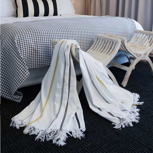 Protea Pinstripe Throw laying on table