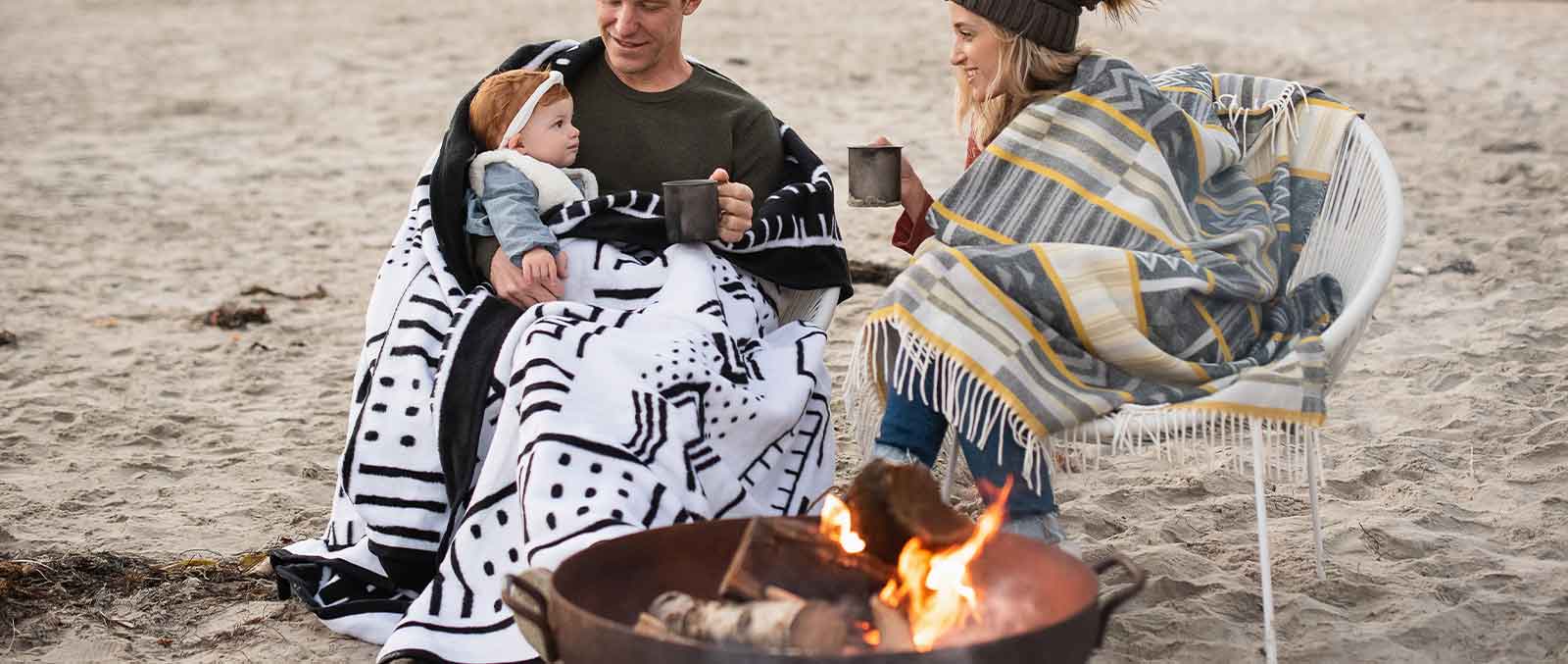 10 Best Wool Blankets for Camping couple at camp with child