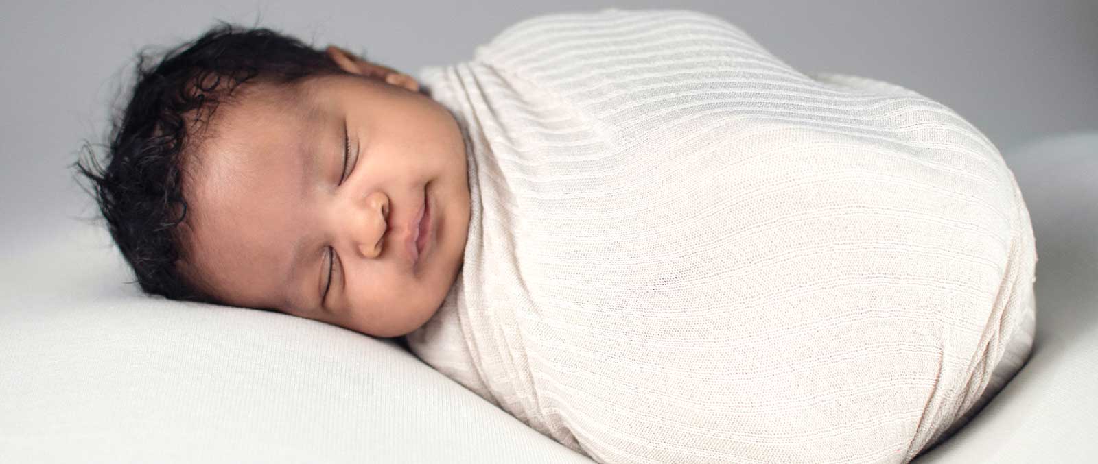 How to swaddle a baby Baby in a tightly wrapped swaddle 