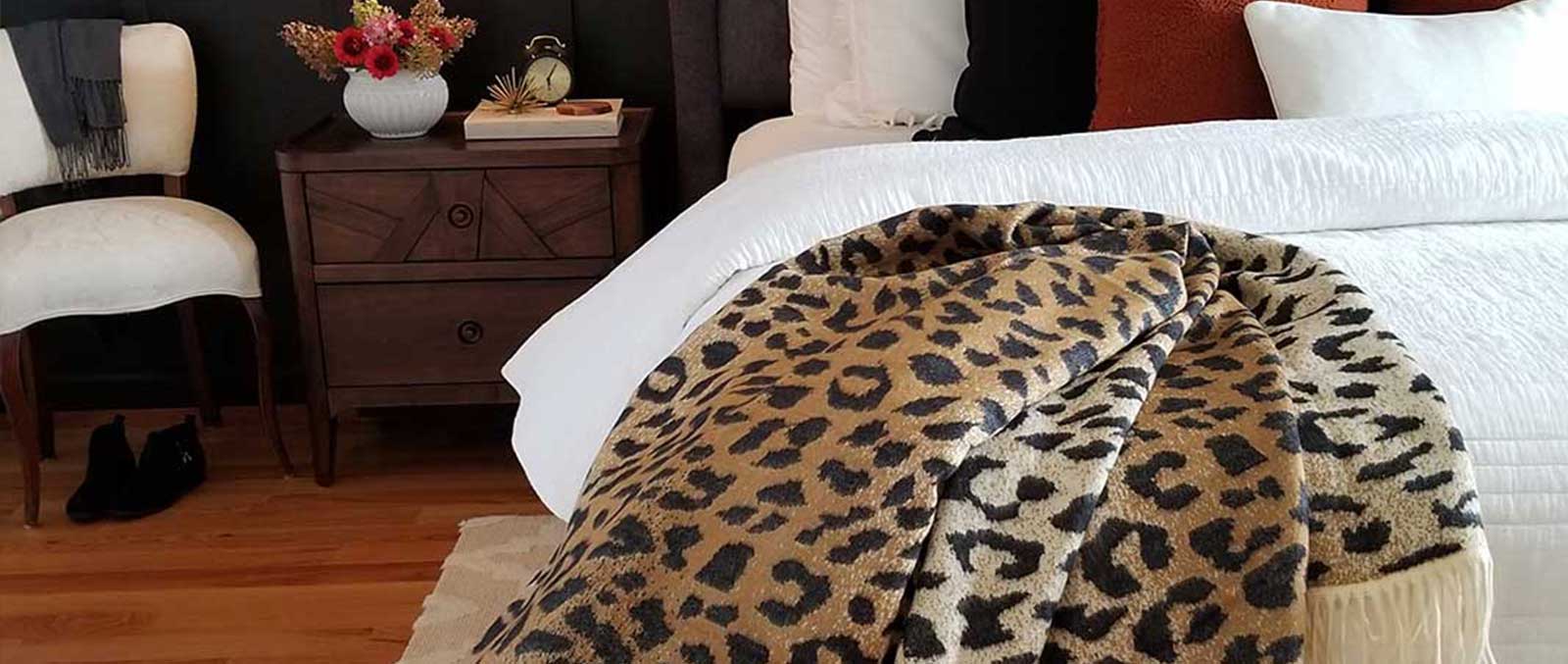 Gorgeous ways to Really Impress You House Guests leopard print African savannah throw on beautiful bed