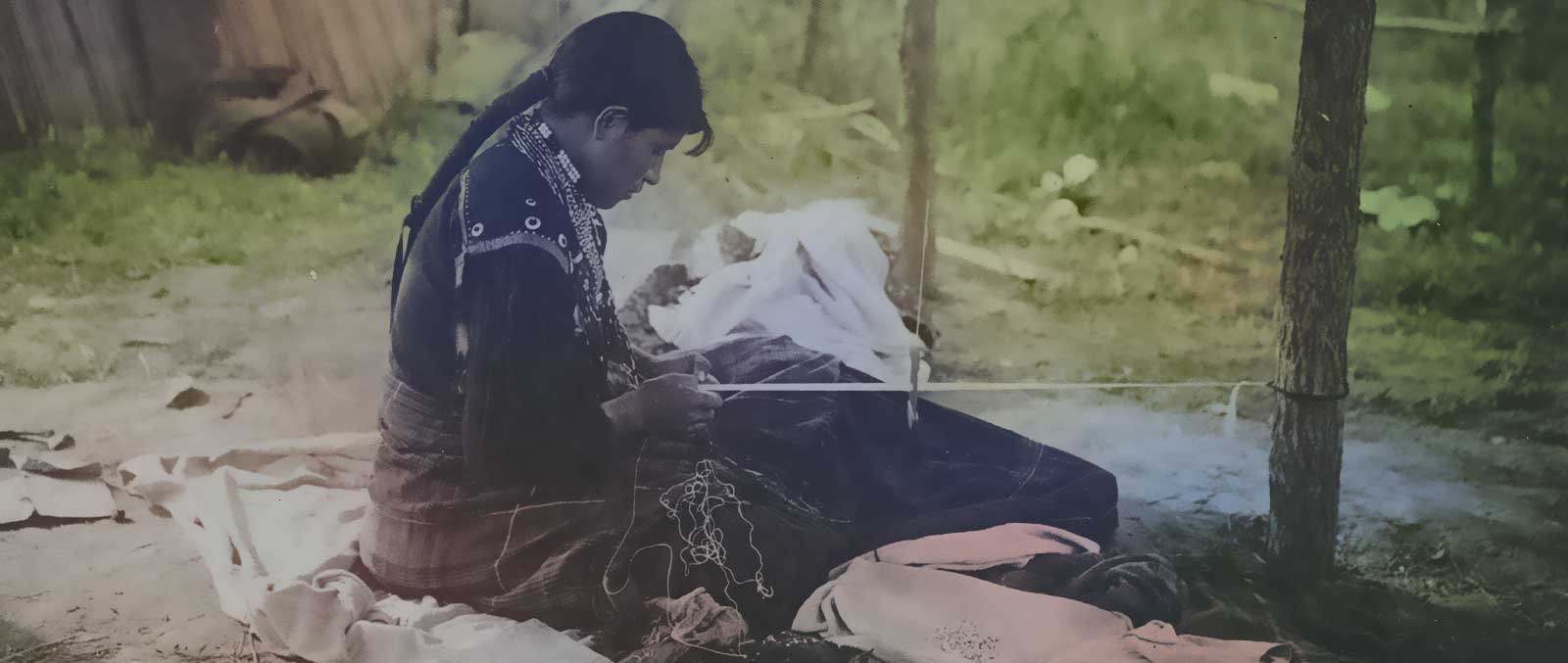a women is making native american blanket with hands