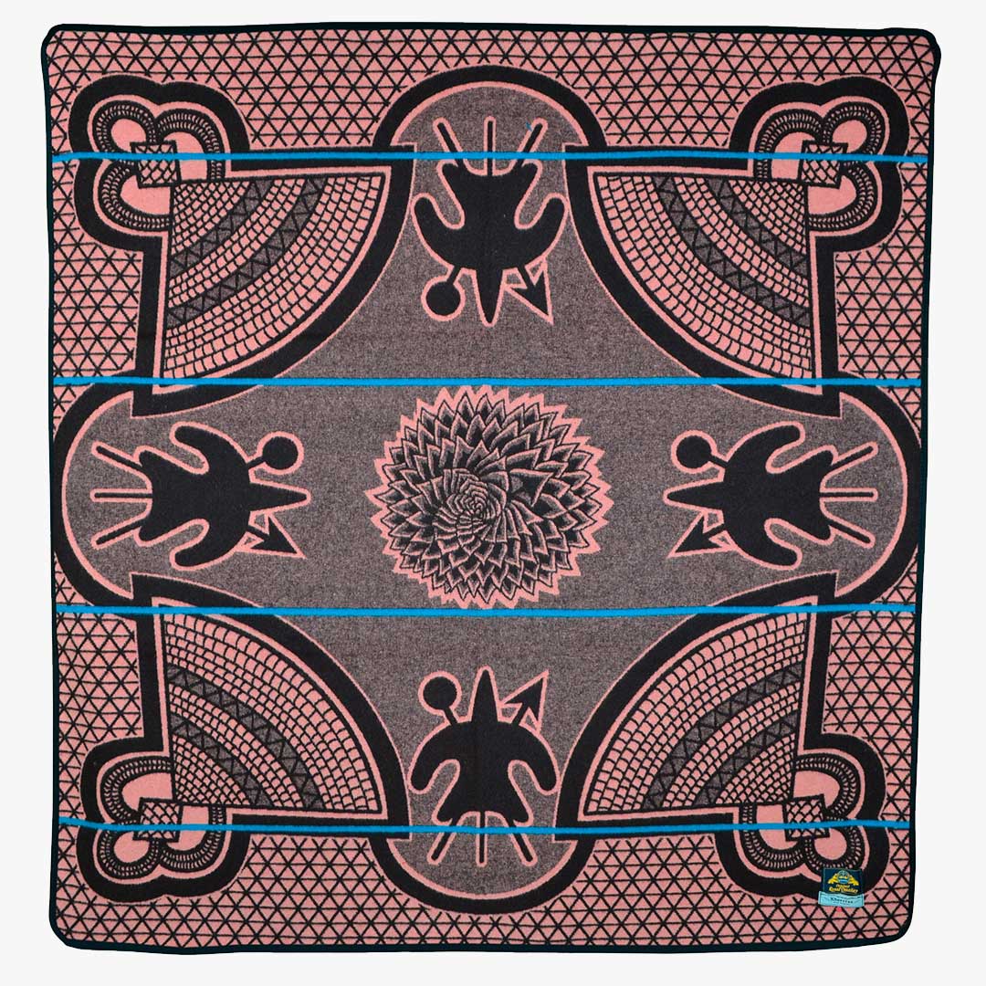 Top view of an authentic Basotho Heritage blanket and wrap or throw made in South Africa color chromatic Salmon and peacock throw The view show the intricate design and layout of the heritage blanket 