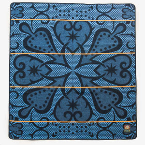 Top view of Authentic SeannaMarena blue and gold Basotho Heritage Wool Blanket and wrap or throw sustainably and ethically crafted in South Africa. The image shows the intricate african design of the Seannamarena heritage blanket