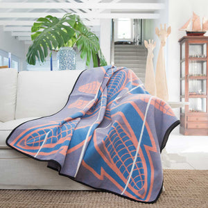 Heirloom Basotho Wool Blanket - Cobalt Yolk Natural lying on sofa