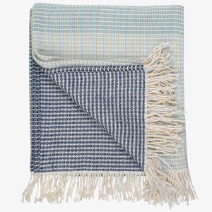  lyric collection blue and white wrap, blanket or throw sustainably and ethically made in South Africa folded on a white background 