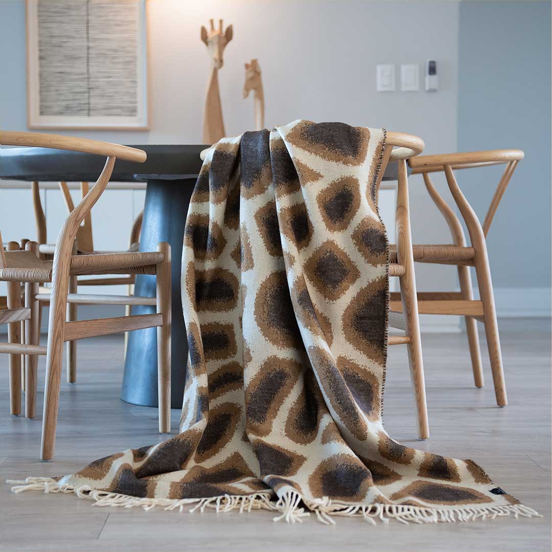 African Giraffe Yoga Throw and Blanket Lying on Table