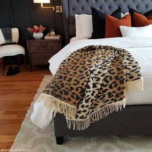 African Leopard Print Yoga Throw and Blanket laying on the bed