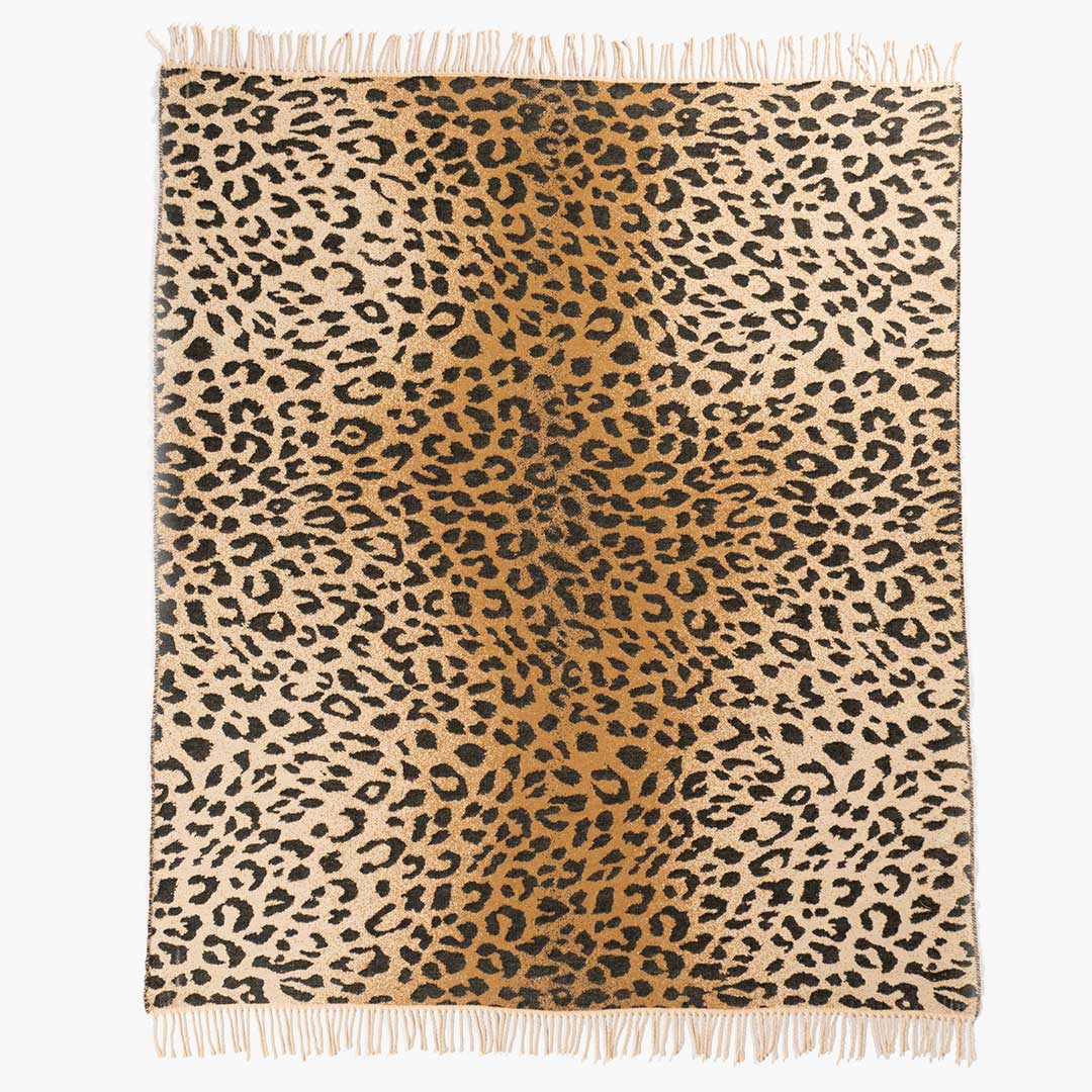 African Leopard Print Yoga Throw and Blanket laying on the sofa