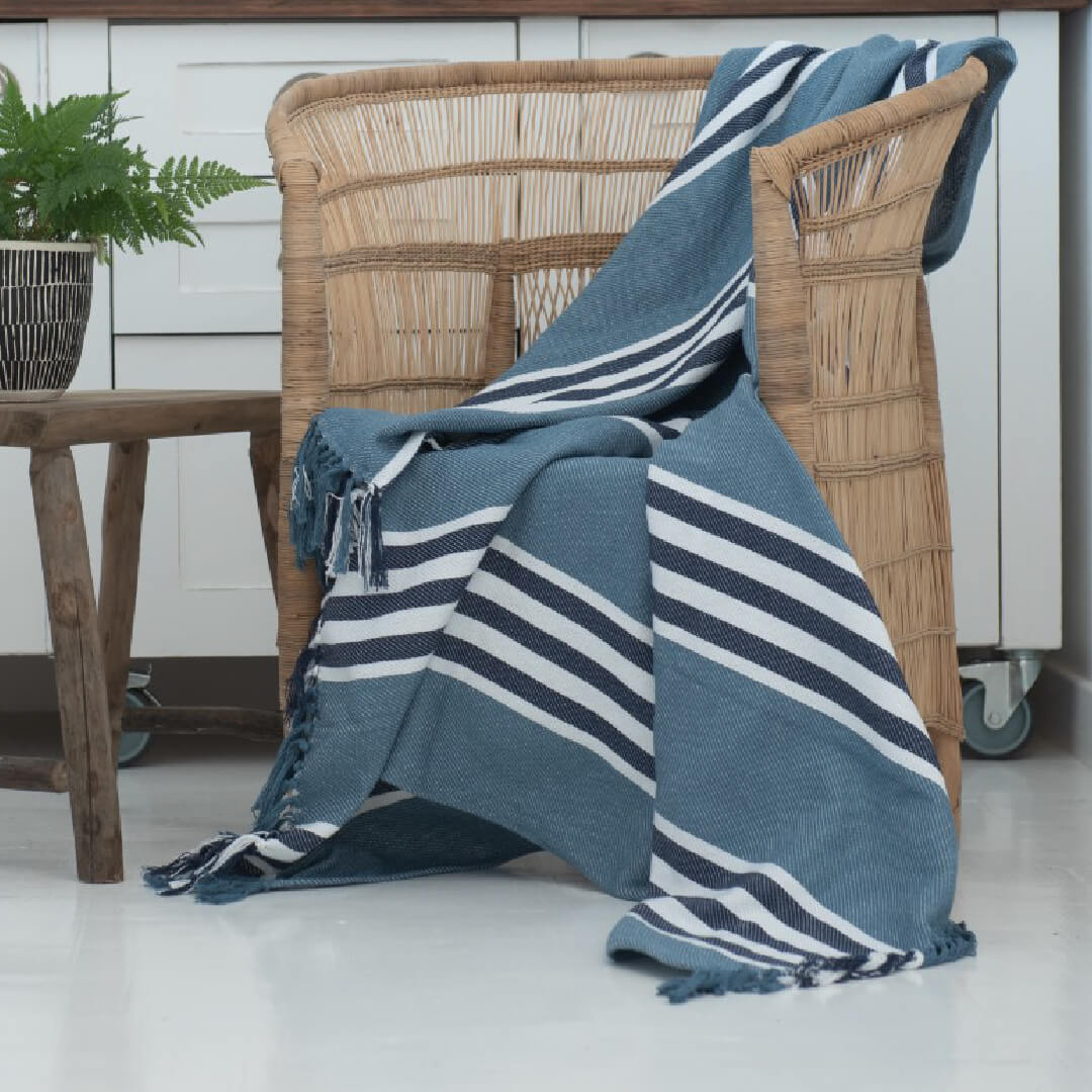 Protea Pinstripe Throw blue laying on chair