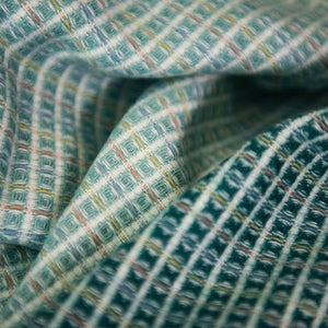 Extreme closeup of lyric collection blue and white wrap, blanket or throw sustainably and ethically made in South Africa shows the intricate weave and colors